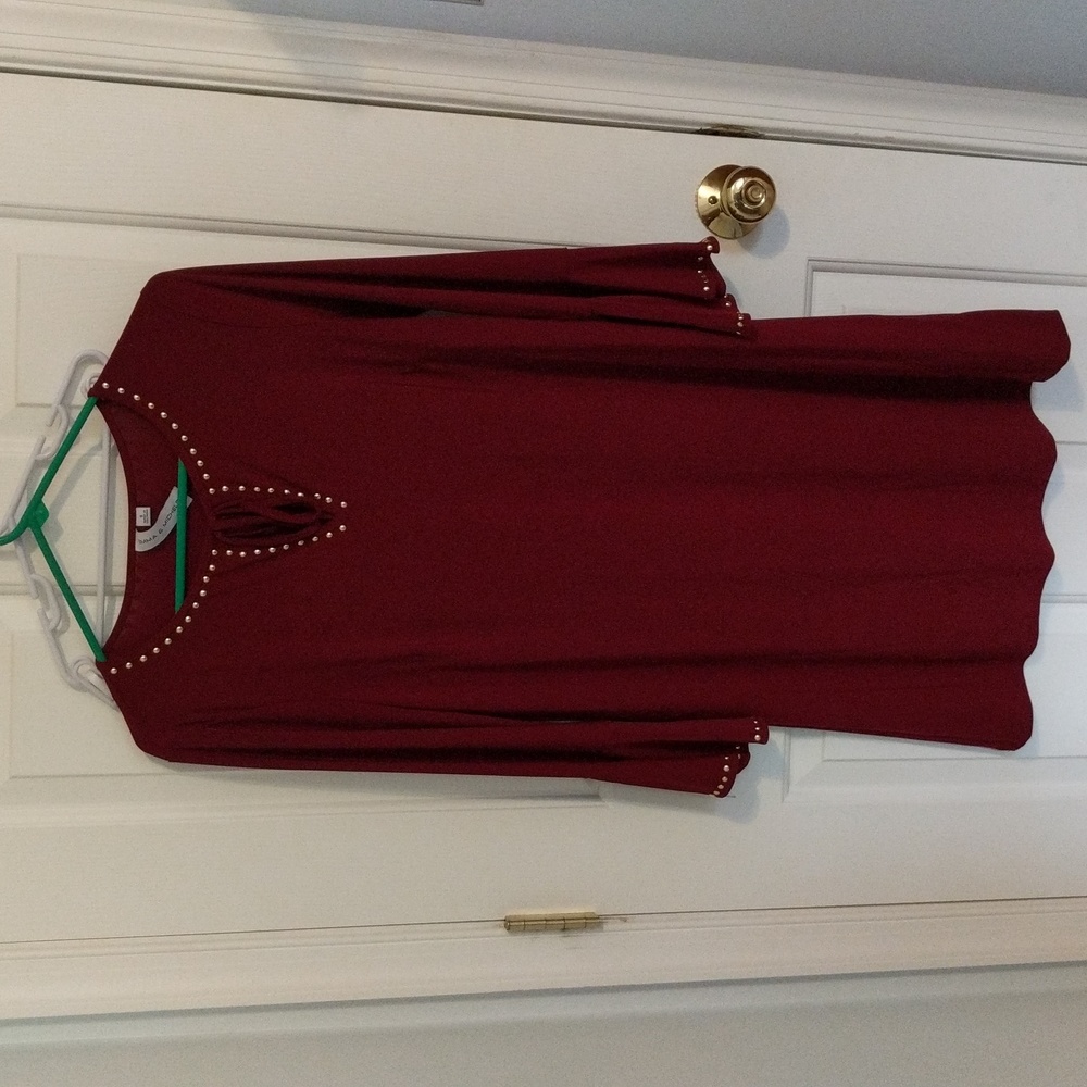 Maroon dress with embellished sleeves and neckline